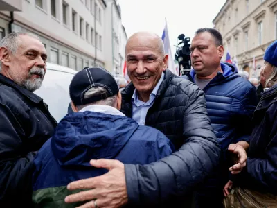 Slovenia's former Prime Minister Janez Jansa greets a supporter after he is acquitted in corruption charges, in Celje, Slovenia April 18, 2025. REUTERS/Borut Zivulovic   TPX IMAGES OF THE DAY