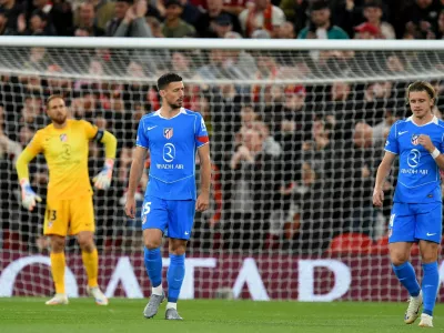 Soccer Football - UEFA Champions League - Liverpool v Atletico Madrid - Anfield, Liverpool, Britain - September 17, 2025 Atletico Madrid's Jan Oblak, Clement Lenglet and Conor Gallagher look dejected after Liverpool's Andy Robertson scores their first goal REUTERS/Peter Powell