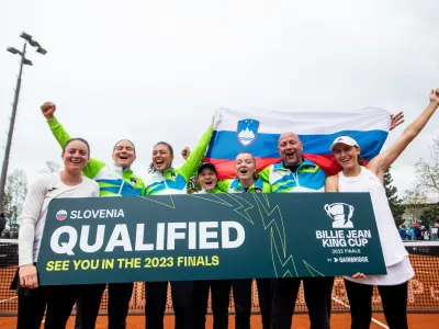 Tamara Zidansek, Ziva Falkner, Ela Nala Milic, Pia Lovric, Nina Potocnik, Andrej Krasevec and Kaja Juvan of Slovenia celebrate after winning during Match #5 at the 2023 Billie Jean King Cup by Gainbridge Qualifiers between Slovenia and Romania, on April 16, 2023 in Bonifika, Koper / Capodistria, Slovenia. Photo by Vid Ponikvar
