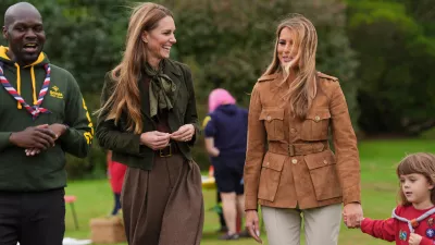 Britain's Kate, Princess of Wales, centre left, and first lady Melania Trump meet members of the Scouts' Squirrels programme in Frogmore Gardens, Windsor, England, Thursday, Sept. 18, 2025. (Yui Mok/Pool Photo via AP)