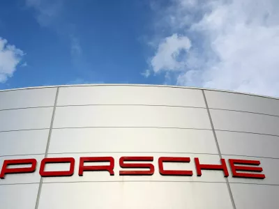 FILE PHOTO: A logo of Porsche is seen outside a Porsche car dealer in Brussels, Belgium March 13, 2023. REUTERS/Yves Herman/File Photo/File Photo