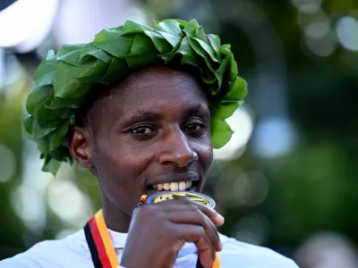 Athletics - Berlin Marathon - Berlin, Germany - September 21, 2025 Gold medallist Kenya's Sabastian Sawe celebrates after winning the Men's elite race REUTERS/Annegret Hilse
