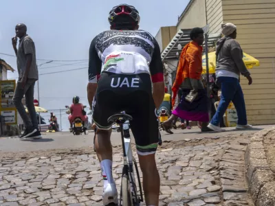 Members of the National UAE team practice on the Wall of Kigali, Rwanda, Friday, Sept. 19, 2025, in anticipation of the upcoming UCI road cycling world championships. (AP Photo/Jerome Delay)