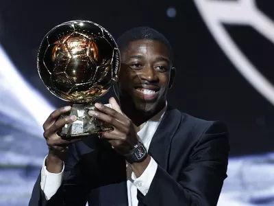 Soccer Football - Ballon d'Or - Theatre du Chatelet, Paris, France - September 22, 2025 Paris St Germain's Ousmane Dembele celebrates after winning the men's Ballon d'Or award REUTERS/Benoit Tessier