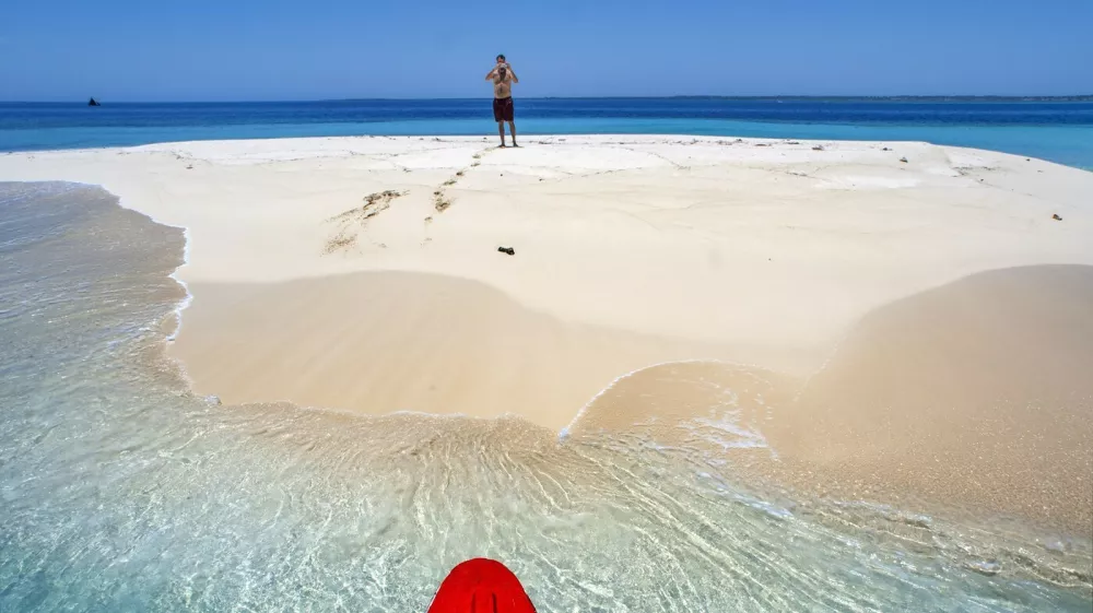 Tourists in a Isolated island uninhabited white sand beach, Ile-a-Vache, Sud Province, Haiti,Image: 1026785123, License: Rights-managed, Restrictions:, Model Release: no