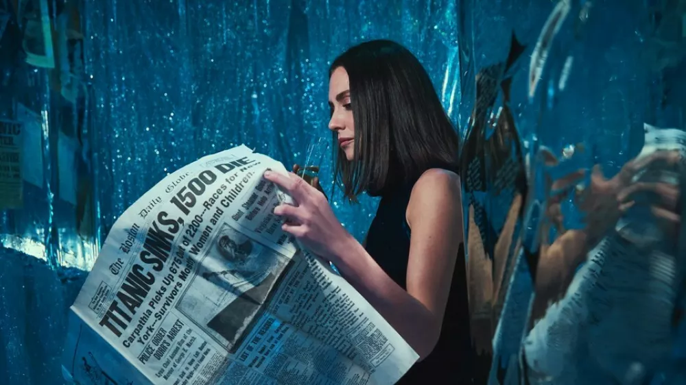 Story from Jam Press (Titanic Decorated Apartment)Pictured: Sarah Boll.Woman who has seen Titanic hundreds of times turns FLAT into ship replica with iceberg &ndash; and invites HINGE date overA woman has turned her flat into the TITANIC complete with a grand staircase and an iceberg &ndash; and she even invited her Hinge date round for a tour.Superfan Sarah Boll has spent months transforming her two-bed rental into a full-blown tribute to the doomed liner &ndash; and she's gone full steam ahead.The 27-year-old says what started as an idea for a small themed party quickly spiralled into an obsession.Now her walls, ceilings and even her bedroom have been revamped to recreate the ship's most famous rooms.From portholes to a "sinking room" and replica artefacts, every room has been styled to make you feel like you're stepping back into 1912."I've been a huge Titanic fanatic, to say the least, since I was 11," the model and a real estate agent told What's The Jam."For my high school graduation, my dad gave me a model ship of the Titanic, and my mom shipped it to me when I had space for it."I was going to have a small Titanic party, but once I started decorating, it was difficult to stop &ndash; especially after I started posting videos on TikTok.'Also, I just love interior design and anything to do with shades of blue and water."Sarah started decorating her New York City apartment in March 2025.Step inside and you're greeted by her version of the Grand Staircase, built with stick-on tiles, plastic ceiling panels and even a salad bowl turned into the glass dome.There are velvet ribbon walls, gold trim, faux greenery and mirrors dressed up as caf&eacute; windows.Sarah says her friends and family have been stunned by the transformation &ndash; but none more so than her Hinge date, who got the full Titanic tour when he came over to visit.She said: "He was totally on board. I told him about my apartment before he came over and asked if he would be okay if I filmed his reaction. He was so chill about it."The reactions from everyone else have been hilarious. Some people like it and others think it's insane."It's been 50/50 &ndash; there's been a lot of, 'I can't decide if she's cool or needs to be institutionalised'"Sarah says the real showstopper is her "sinking room", where visitors can first see Titanic sailing on a starry night before it hits the iceberg.Walking into the room, a model ship dangles from the ceiling mid-sink while a dresser painted to look like the liner appears to go down beneath the waves.The floor shimmers with mirrored silver paper like water, fabric drapes create the feel of being underwater and mini replicas show the wreck on the seabed.Sarah has even filled drawers with sand and crockery to echo what divers found.The bathroom continues the theme, covered in mirrored paper and newspaper clippings, with all 1,500 victims' names written out and stuck on the walls.Meanwhile, her bedroom has been styled as a first-class suite, complete with a gold comforter and a porthole by the bed.Sarah admits the whole thing came together impulsively &ndash; with no real plan &ndash; and she hasn't even kept track of how much it cost.She's since built a following of 18,000 online by sharing TikTok tours of her ship-shaped flat, with viewers torn between calling her a genius or saying she's lost the plot.And while Sarah says she may eventually change her apartment theme, for now she's staying firmly on board the Titanic &ndash; enjoying what she calls the best summer of her life.She said: "I'll switch up the theme eventually; I'm planning on an Alice in Wonderland theme."I'm not sure when I'll do that though. I want my parents to see Titanic first."I love my apartment &ndash; I've never had a better summer in my life."ENDSEDITOR'S NOTE: Video Usage Licence: (EXCLUSIVE) We have obtained an exclusive licence from the copyright holder. A copy of the licence is available on request.Video Restrictions: None.,Image: 1035233012, License: Rights-managed, Restrictions: EDITOR'S NOTE: Video Usage Licence: (EXCLUSIVE) We have obtained an exclusive licence from the copyright holder. A copy of the licence is available on request.Video Restrictions: None., Model Release: no