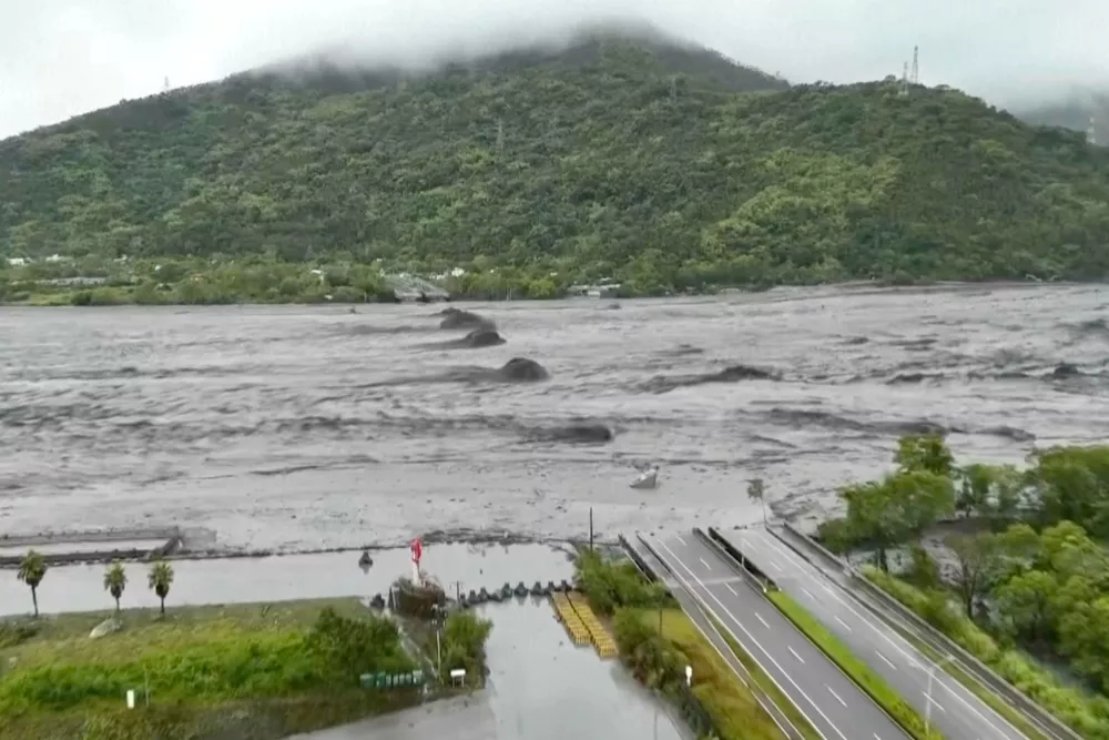 In this photo taken from Sept. 23, 2025 video and released by Dong Wen Transports, a drone shot shows the remaining piers of the Mataian Bridge after it collapsed during typhoon Super Typhoon Ragasa passing through Hualien in eastern Taiwan. (Dong Wen Transports via AP)