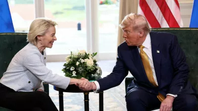 FILE PHOTO: U.S. President Donald Trump shakes hands with European Commission President Ursula von der Leyen, after an announcement of a trade deal between the U.S. and EU, in Turnberry, Scotland, Britain, July 27, 2025. REUTERS/Evelyn Hockstein/File Photo