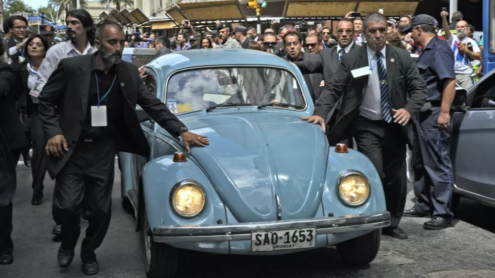 Former Uruguayan president Jose Pepe Mujica inside his Volkswagen 1987 leave the Plaza Independencia, after the inauguration of the new President Tabare Vazquez on March 1, 2015 in Montevideo. Known for his push to legalize cannabis, spartan lifestyle and devotion to his three-legged dog, Uruguay's outspoken President Jose "Pepe" Mujica will step down Sunday more popular than ever.,Image: 221817834, License: Rights-managed, Restrictions:, Model Release: no
