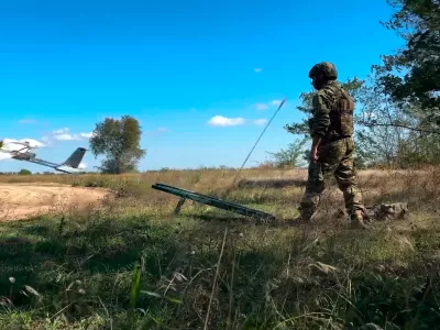 In this photo taken from video distributed by Russian Defense Ministry Press Service on Wednesday, Sept. 24, 2025, A Russian soldier launches a drone for an action in an undisclosed location in Ukraine. (Russian Defense Ministry Press Service via AP)