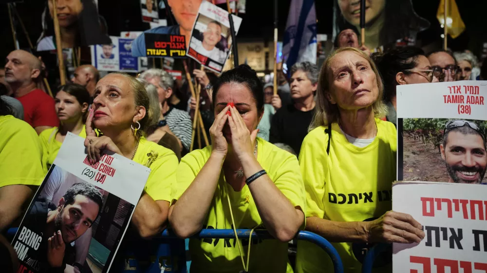 Relatives and supporters of Israeli hostages held in the Gaza Strip attend a rally demanding their release from Hamas captivity and calling for an end to the war, in Tel Aviv, Israel, Saturday, Sept. 27, 2025. (AP Photo/Ariel Schalit)