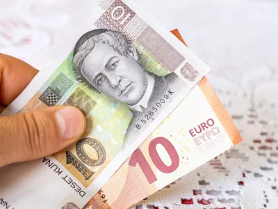 Money in hand, Croatian kuna and Euro, Concept of Croatians joining the euro zone and currency exchange