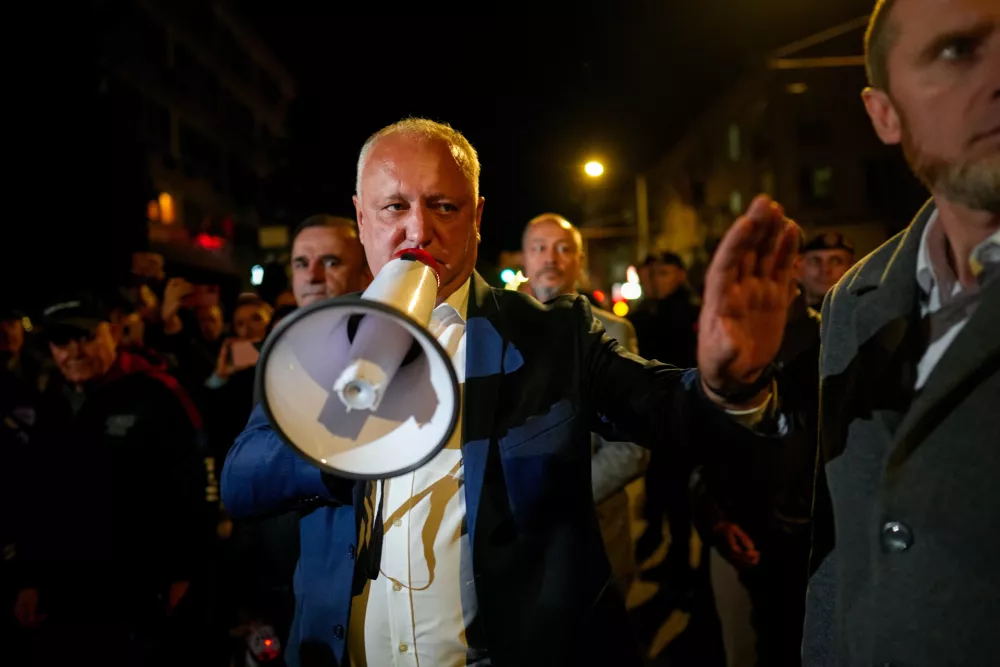 Former Moldovan President Igor Dodon, a member of the Russia-friendly Patriotic Electoral Bloc, speaks to supporters gathered outside the Electoral Commission after the polls closed for the parliamentary election, in Chisinau, Moldova, Sunday, Sept. 28, 2025. (AP Photo/Vadim Ghirda)