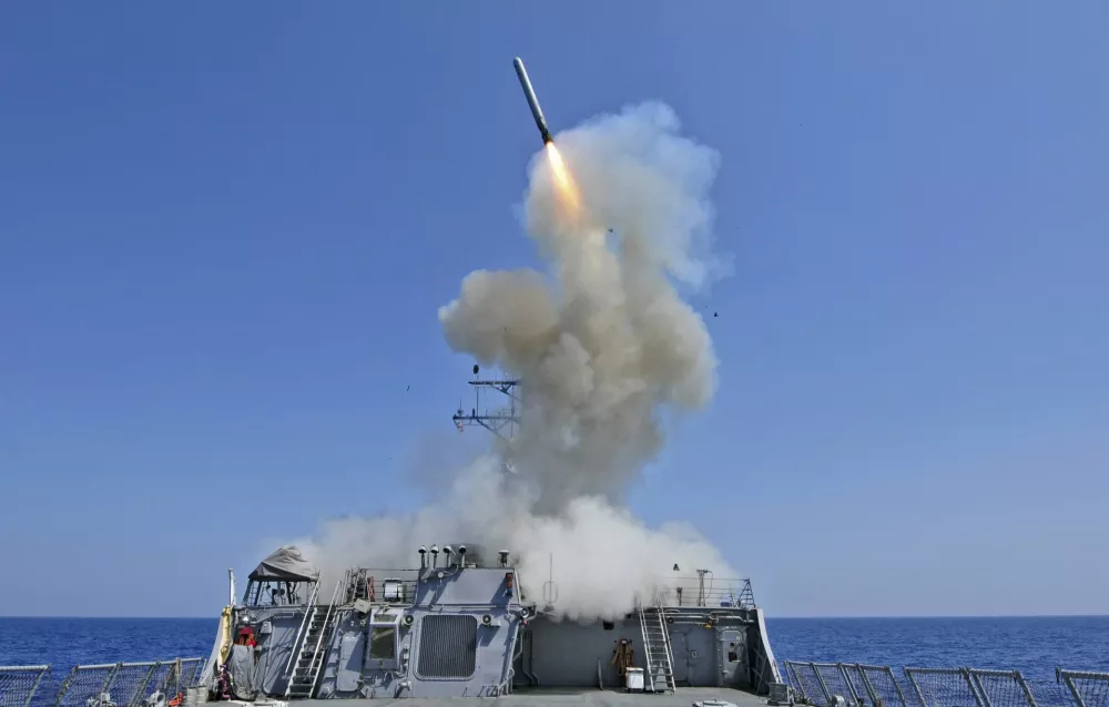 The guided-missile destroyer USS Barry launches a Tomahawk cruise missile from the ship's bow in the Mediterranean Sea in this U.S. Navy handout photo taken March 29, 2011. Barry is one of four U.S. destroyers currently deployed in the Mediterranean Sea equipped with long-range Tomahawk missles that could potentially be used to strike Syria, according to officials.  REUTERS/Jonathan Sunderman/U.S. Navy/Handout/Files  (ITALY - Tags: MILITARY POLITICS CIVIL UNREST) FOR EDITORIAL USE ONLY. NOT FOR SALE FOR MARKETING OR ADVERTISING CAMPAIGNS