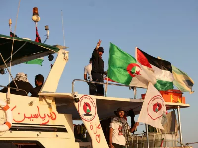 FILE PHOTO: Crew interacts from aboard a boat, part of the Global Sumud Flotilla aiming to reach Gaza and break Israel's naval blockade, as it sails off Koufonisi islet, Greece, September 26, 2025. REUTERS/Stefanos Rapanis/File Photo