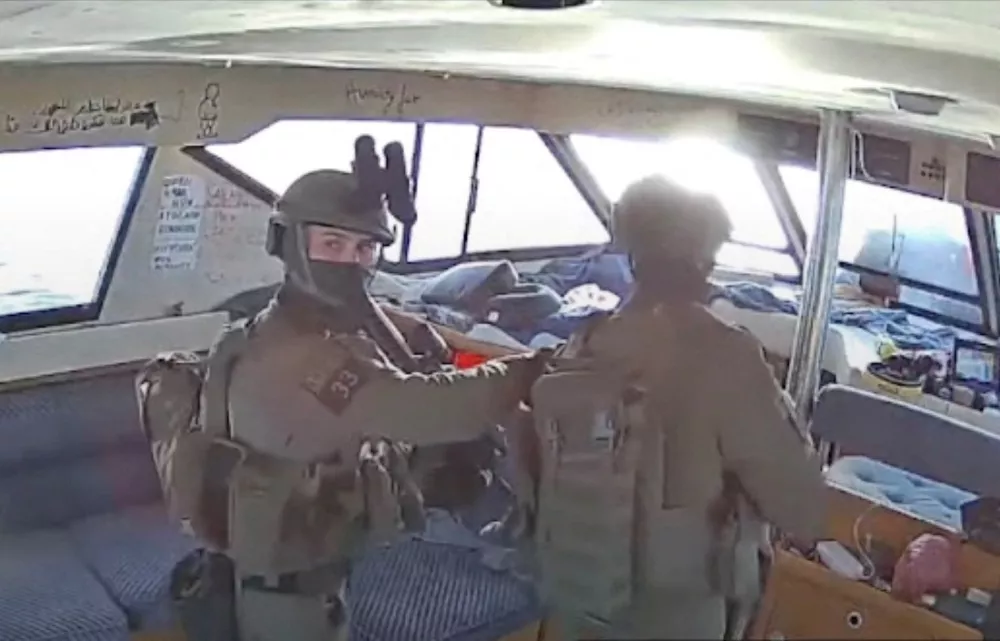 A screengrab from a live stream video shows Israeli navy forces aboard the Gaza-bound vessel Captain Nikos, part of the Global Sumud Flotilla, which flotilla organisers report has been intercepted, October 2, 2025. Global Sumud Flotilla/Handout via REUTERS THIS IMAGE HAS BEEN SUPPLIED BY A THIRD PARTY. MANDATORY CREDIT. NO RESALES. NO ARCHIVES.