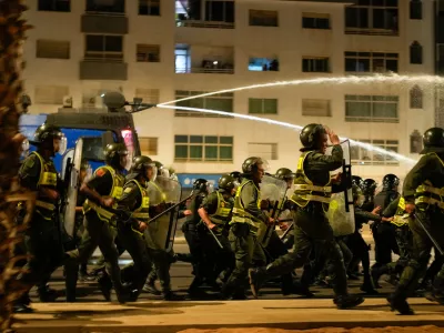 Security forces disperse a gathering as youth led protests calling for healthcare and education reforms turned violent, in Sale, Morocco, Wednesday, Oct. 1, 2025. (AP Photo/Mosa'ab Elshamy)