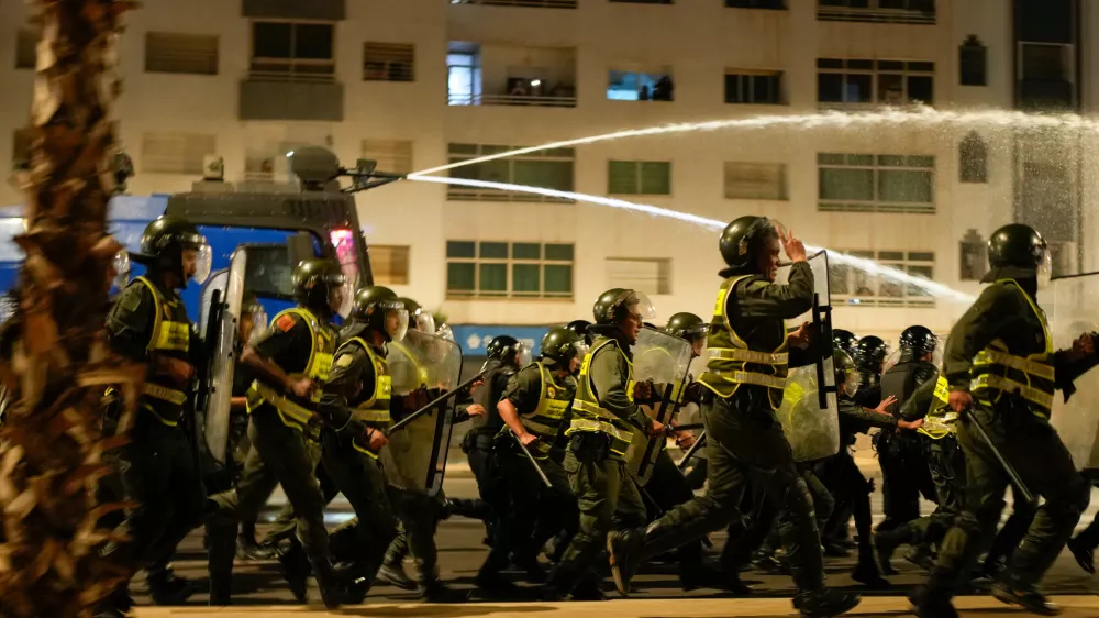 Security forces disperse a gathering as youth led protests calling for healthcare and education reforms turned violent, in Sale, Morocco, Wednesday, Oct. 1, 2025. (AP Photo/Mosa'ab Elshamy)