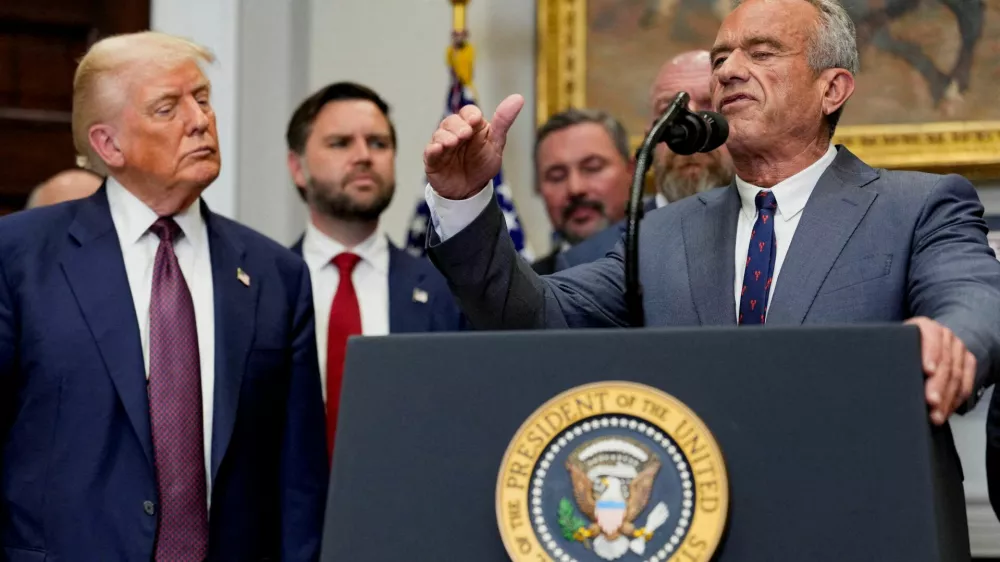 FILE PHOTO: U.S. Health and Human Services Secretary Robert F. Kennedy Jr. gestures as he delivers remarks next to U.S. President Donald Trump in the Roosevelt Room at the White House in Washington, D.C., U.S., July 31, 2025. REUTERS/Kent Nishimura/File Photo