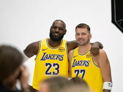 Los Angeles Lakers' LeBron James (23) poses with Luka Doncic (77) during the NBA basketball team's media day in El Segundo, Calif., Monday, Sept. 29, 2025. (AP Photo/Jae C. Hong)