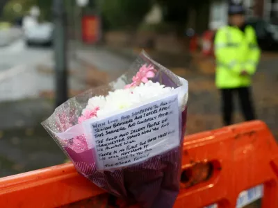 A floral tribute is left outside the Manchester synagogue, where multiple people were killed on Yom Kippur in what police have declared a terrorist incident, in north Manchester, Britain, October 3, 2025. REUTERS/Temilade Adelaja