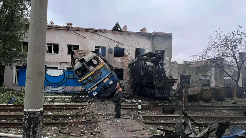 A railway employee stands next to a destroyed train at the compound of a depot after it was hit during an overnight Russian drone strike, amid Russia's attack on Ukraine, in Odesa, Ukraine October 2, 2025. Deputy Prime Minister for Restoration of Ukraine and Minister for Communities and Territories Development of Ukraine Oleksii Kuleba via Facebook/Handout via REUTERS ATTENTION EDITORS - THIS IMAGE HAS BEEN SUPPLIED BY A THIRD PARTY. NO RESALES. NO ARCHIVES.