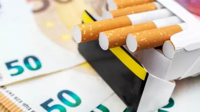 Pack of cigarettes on the euro bills. Close up.