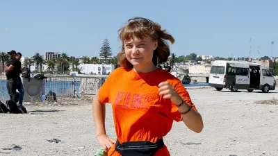 Swedish activist Greta Thunberg, a member of the Global Sumud Flotilla, walks as the flotilla waits to set sail towards Gaza, with other boats from Tunisia, as part of an international humanitarian aid initiative to break Israel's naval blockade and deliver vital supplies to Palestinians, at the port of Bizerte, Tunisia September 13, 2025. REUTERS/Zoubeir Souissi   TPX IMAGES OF THE DAY