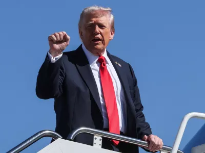 U.S. President Donald Trump gestures as he boards Air Force One for travel to Norfolk, Virginia, at Joint Base Andrews, Maryland, U.S., October 5, 2025. REUTERS/Jonathan Ernst
