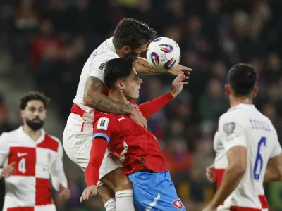 Soccer Football - FIFA World Cup - UEFA Qualifiers - Group L - Czech Republic v Croatia - Fortuna Arena, Prague, Czech Republic - October 9, 2025 Croatia's Duje Caleta-Car in action with Czech Republic's Martin Vitik REUTERS/David W Cerny