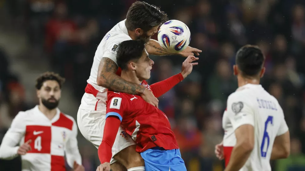 Soccer Football - FIFA World Cup - UEFA Qualifiers - Group L - Czech Republic v Croatia - Fortuna Arena, Prague, Czech Republic - October 9, 2025 Croatia's Duje Caleta-Car in action with Czech Republic's Martin Vitik REUTERS/David W Cerny