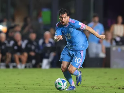 Oct 4, 2025; Fort Lauderdale, Florida, USA; Inter Miami CF forward Lionel Messi (10) dribbles the ball against New England Revolution during the first half at Chase Stadium. Mandatory Credit: Sam Navarro-Imagn Images