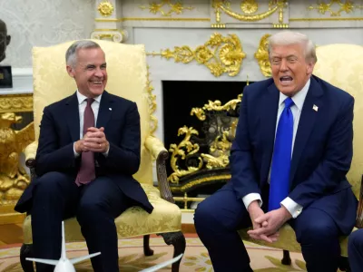 Canada Prime Minister Mark Carney and President Donald Trump hold a press conference at the White House in Washington, Tuesday, Oct. 7, 2025. (Adrian Wyld/The Canadian Press via AP)