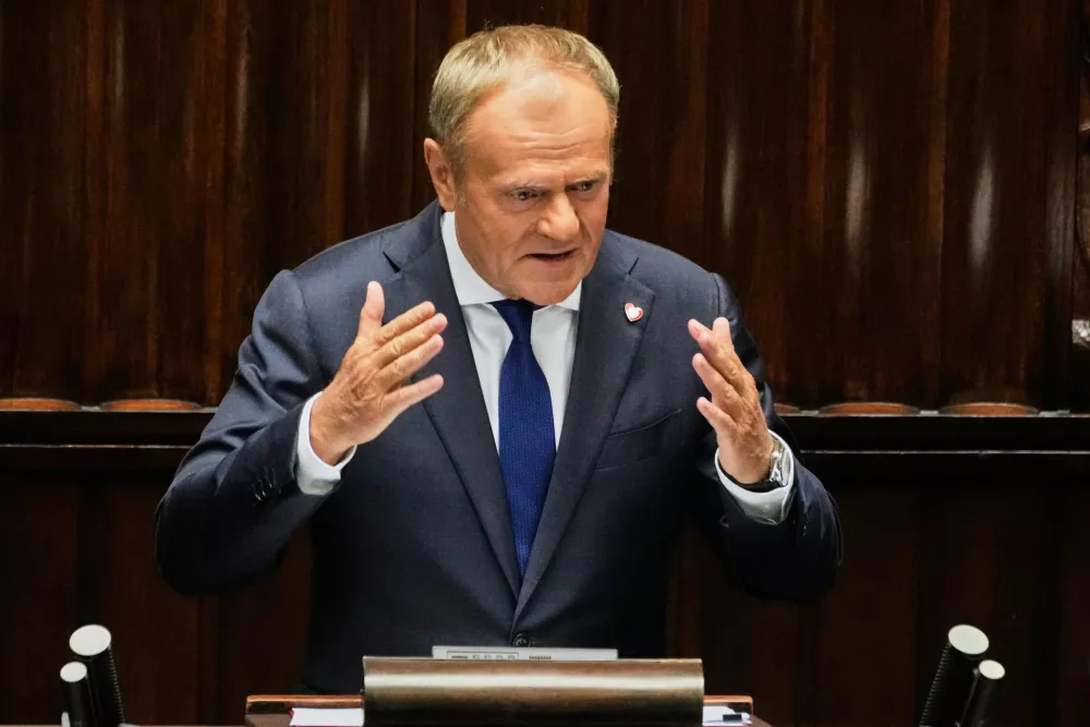 Poland's Prime Minister Donald Tusk addresses the Polish parliament on Wednesday, June 11, 2025, in Warsaw, Poland. (AP Photo/Czarek Sokolowski)