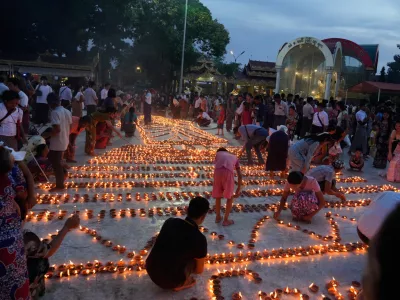 Buddhist devotees light oil lamps at Botataung pagoda during celebrations of the full moon day of Thadingyut, the end of Buddhist Lent, Monday, Oct. 6, 2025, in Yangon, Myanmar. (AP Photo/Thein Zaw)