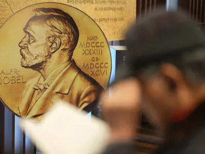 FILE - A visitor reads a book written by South Korean author Han Kang, this year's winner of the Nobel Prize in Literature, at a special section of a bookstore in Seoul, South Korea, Tuesday, Dec. 10, 2024. (AP Photo/Lee Jin-man, File)