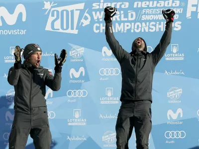 Snowboarding - FIS Snowboarding and Freestyle Skiing World Championships - Men's Snowboard Parallel Slalom - Sierra Nevada, Spain - 15/03/17 -  Gold medalist Andreas Prommegger of Austria (R) and silver medalist Benjamin Karl of Austria react on the podium. REUTERS/Albert Gea