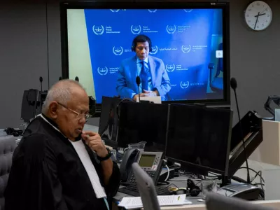 FILE PHOTO: Former Philippine President Rodrigo Duterte is seen on a screen in the courtroom of the International Criminal Court (ICC) with his lawyer Salvador Medialdea seated left, in The Hague, Netherlands, Friday, March 14, 2025. Peter Dejong/Pool via REUTERS//File Photo