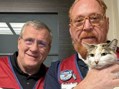 Story from Jam Press (Missing Cat Found)Pictured: Wayne Schneider and Mike Sida with Francine.Beloved shop cat found 90 miles from home after determined community launches DRONES in major search operationA beloved shop cat was found 90 miles from her home after a community launched drones in a bid to track her down.Francine, a stray who has lived at a DIY store for eight years, went missing in mid-September, sparking a desperate search.Staff launched a massive rescue mission using thermal drones, professional trackers, and hours of CCTV footage, as reported by NeedToKnow.It soon became clear the cheeky moggy had accidentally hopped onto a truck bound for the company's distribution centre.Signs, humane traps, and cameras were set up across the site in Garysburg, North Carolina, US, with asset protection teams monitoring every clue.On Saturday (4 October), Francine was finally caught on camera - and moments before midnight, she was safely trapped using her favourite food."She looked at us and gave this big meow like, 'What took you so long?'" said Wayne Schneider, of Lowe's Home Improvement in Richmond, Virginia, who was reunited with the cat on Monday (6 October).Store manager Mike Sida added: "From the start, we knew we'd do whatever it took to bring Francine home."She's part of who we are here."The pair made the 90-minute drive at 4am on Monday (6 October) to collect their furry colleague and bring her back to Richmond.Sida added: "She has always been a beacon for our customers."She's more than our store cat - she's part of our family."ENDS,Image: 1044132494, License: Rights-managed, Restrictions:, Model Release: no