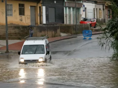 A van in the Rambla de Beniajan hit by heavy rains due to a red alert, on October 10, 2025, in Murcia, Region of Murcia (Spain). The City Council of Cartagena has ordered the eviction of people in Villas Caravaning, Bahia Bella and La Algameca, to the accumulation of water from rain and runoff in these areas of the municipality. Also, the eviction of Navantia workers is taking place, as the factory is located next to the Benipila wadi. In the pavilion there are fifty beds and staff of Civil Protection and Social Services to ensure the care of all persons requiring assistance.OCTOBER 10;202510/10/2025,Image: 1044594555, License: Rights-managed, Restrictions:, Model Release: no