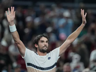 Valentin Vacherot of Monaco celebrates after defeating Novak Djokovic of Serbia in the men's singles semifinal match of the Shanghai Masters tennis tournament at Qizhong Forest Sports City Tennis Center, in Shanghai, China, Saturday, Oct. 11, 2025. (AP Photo/Andy Wong)