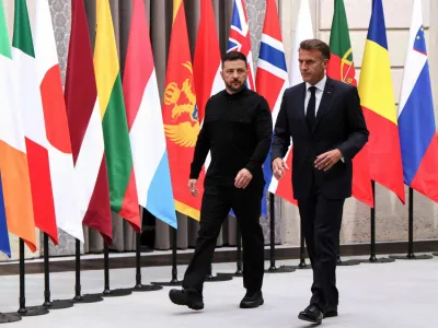 FILE PHOTO: French President Emmanuel Macron and Ukrainian President Volodymyr Zelenskiy arrive to chair the Coalition of the Willing Summit at Elysee presidential palace in Paris, France, September 4, 2025. Ludovic Marin/Pool via REUTERS/File Photo