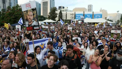 People gather at "Hostages Square" to await the expected return of Israeli hostages, who have been held in Gaza since the deadly October 7, 2023 attack by Hamas, as part of a prisoner-hostage swap and a ceasefire deal between Israel and Hamas, in Tel Aviv, Israel, October 13, 2025. REUTERS/Ronen Zvulun