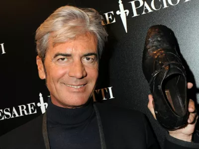 Italian shoe designer Cesare Paciotti holds a shoe he made for English football player David Beckham on January 19, 2009 during the Men's fashion week in Milan.,Image: 29110447, License: Rights-managed, Restrictions: TO GO WITH AFP STORY BY KATIA DOLMADJIAN, Model Release: no
