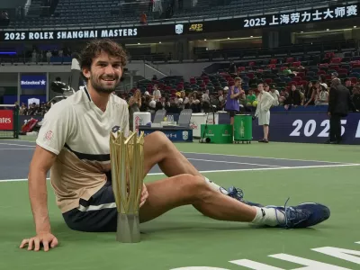 Valentin Vacherot of Monaco poses with trophy after winning the final of the Shanghai Masters tennis tournament defeating Arthur Rinderknech of France at Qizhong Forest Sports City Tennis Center, in Shanghai, China, Sunday, Oct. 12, 2025. (AP Photo/Andy Wong)
