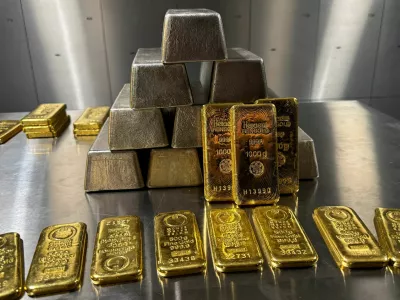 Gold and silver bars are stacked in the safe deposit boxes room of the Pro Aurum gold house in Munich, Germany, October 13, 2025. REUTERS/Angelika Warmuth