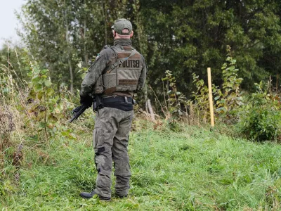 An Estonian border guard patrols the Russian border near Vinski, Estonia, Monday, Sept. 15, 2025. (AP Photo/Hendrik Osula)