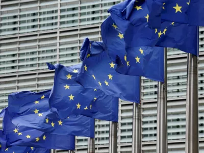 FILE PHOTO: European Union flags flutter outside the EU Commission headquarters in Brussels, Belgium July 16, 2025. REUTERS/Yves Herman//File Photo