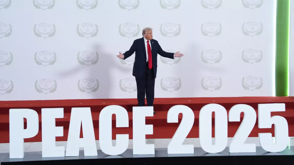 President Donald Trump waits to greet leaders during a summit to support ending the more than two-year Israel-Hamas war in Gaza after a breakthrough ceasefire deal, Monday, Oct. 13, 2025, in Sharm El Sheikh, Egypt. (AP Photo/Evan Vucci, Pool)