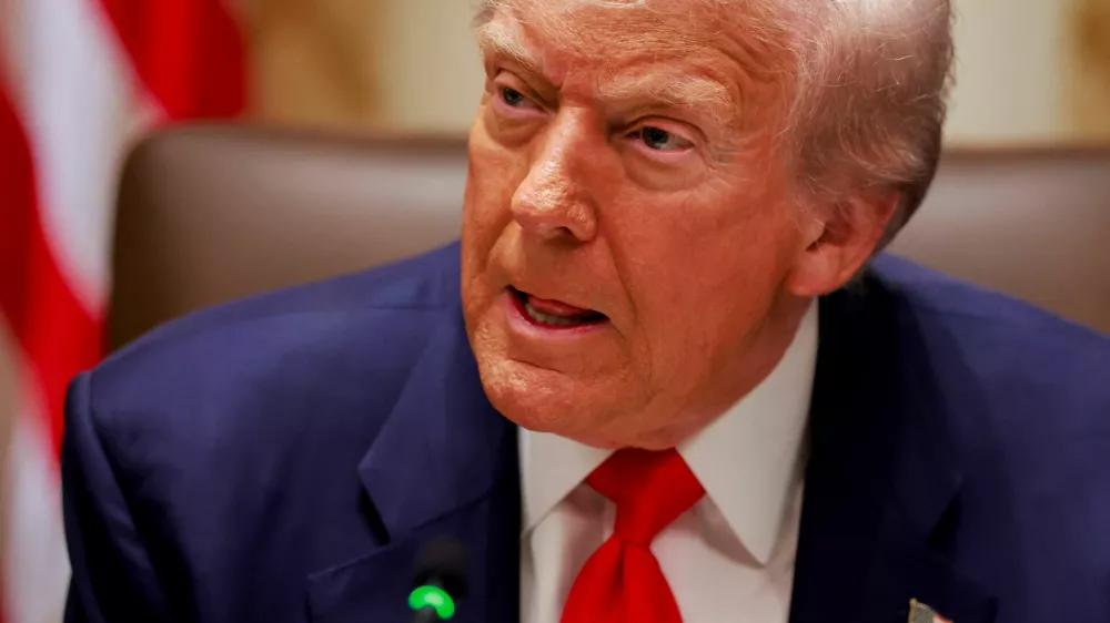 U.S. President Donald Trump listens to a reporter's question before his lunch with Argentina's President Javier Milei in the Cabinet Room at the White House in Washington, D.C., U.S., October 14, 2025. REUTERS/Jonathan Ernst